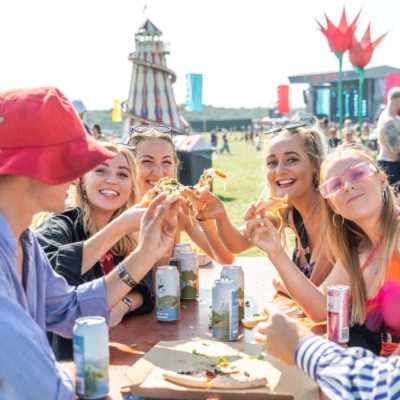 Festival goers sharing pizza 4